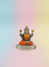 Statue of a seated deity on a gradient background