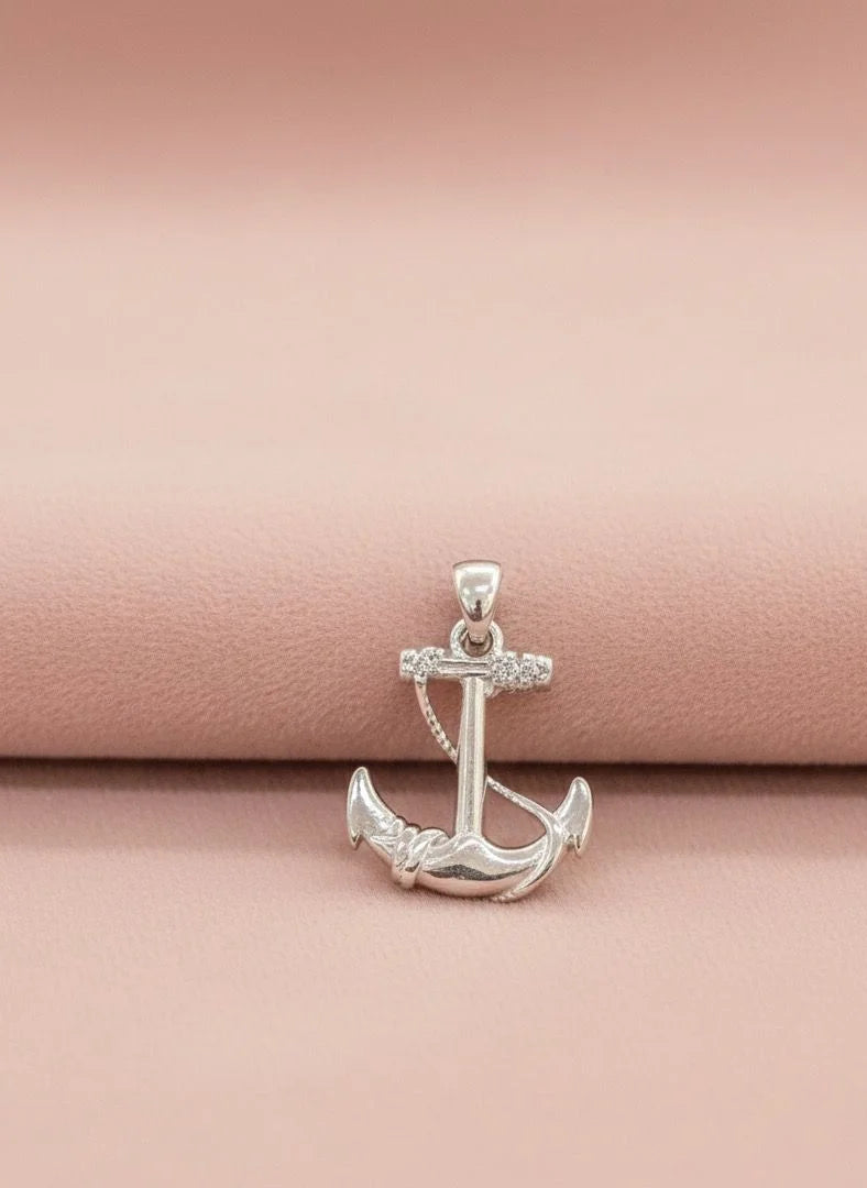 Silver anchor pendant on a pink background
