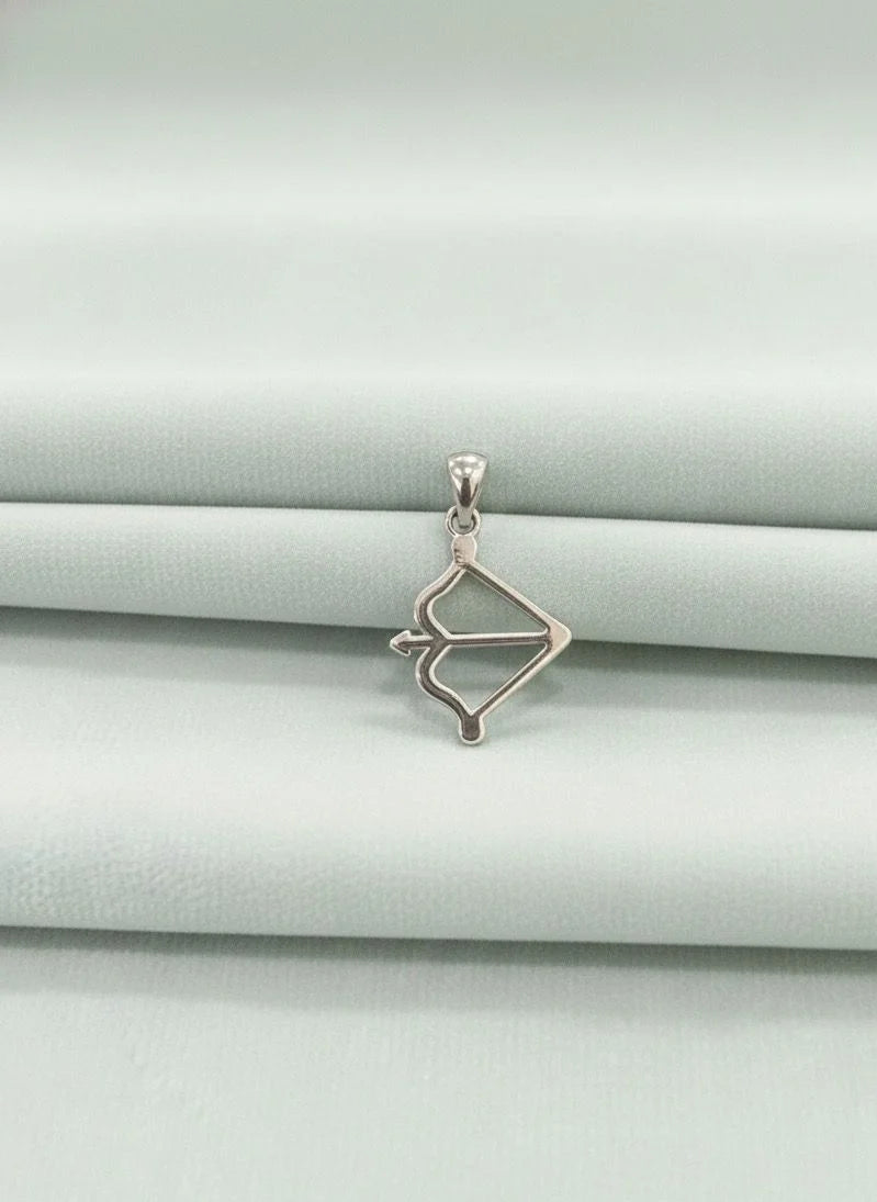 Silver pendant on a light gray background