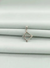 Silver pendant on a light gray background