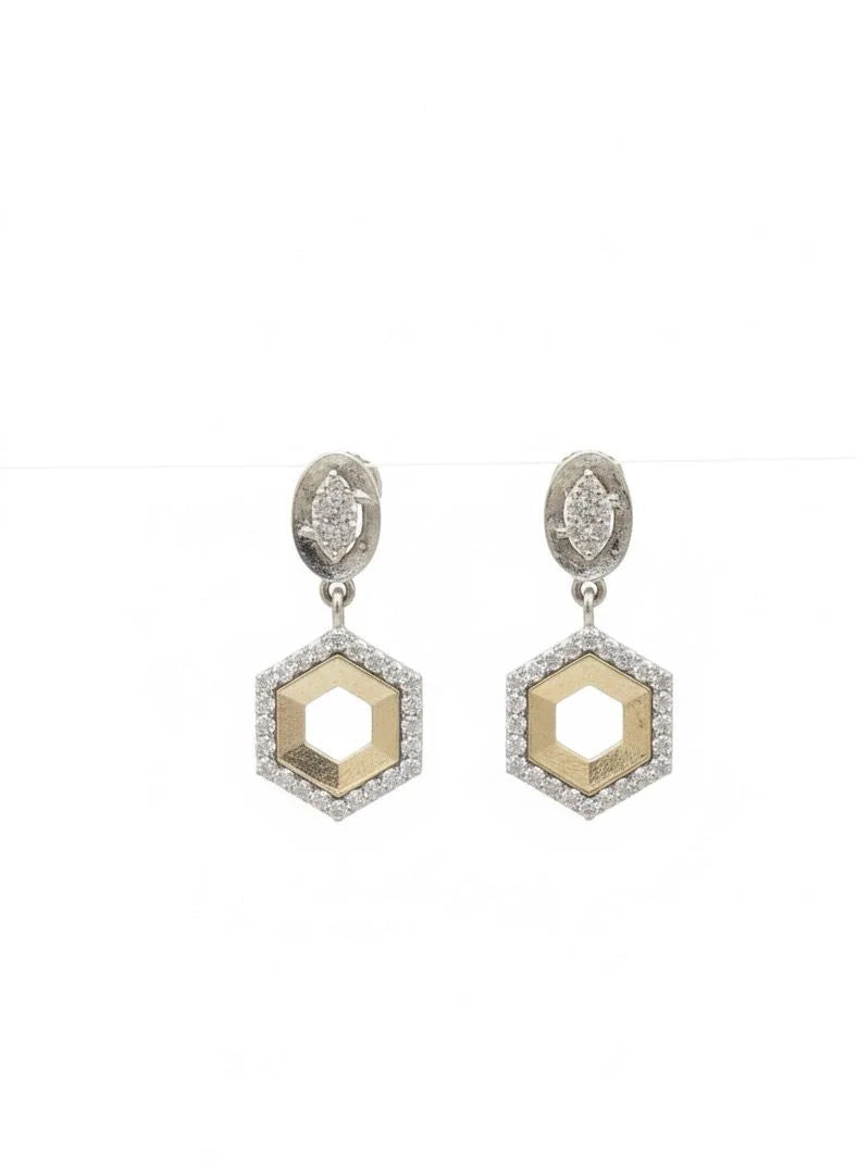 Hexagonal earrings with diamond-like stones on a white background