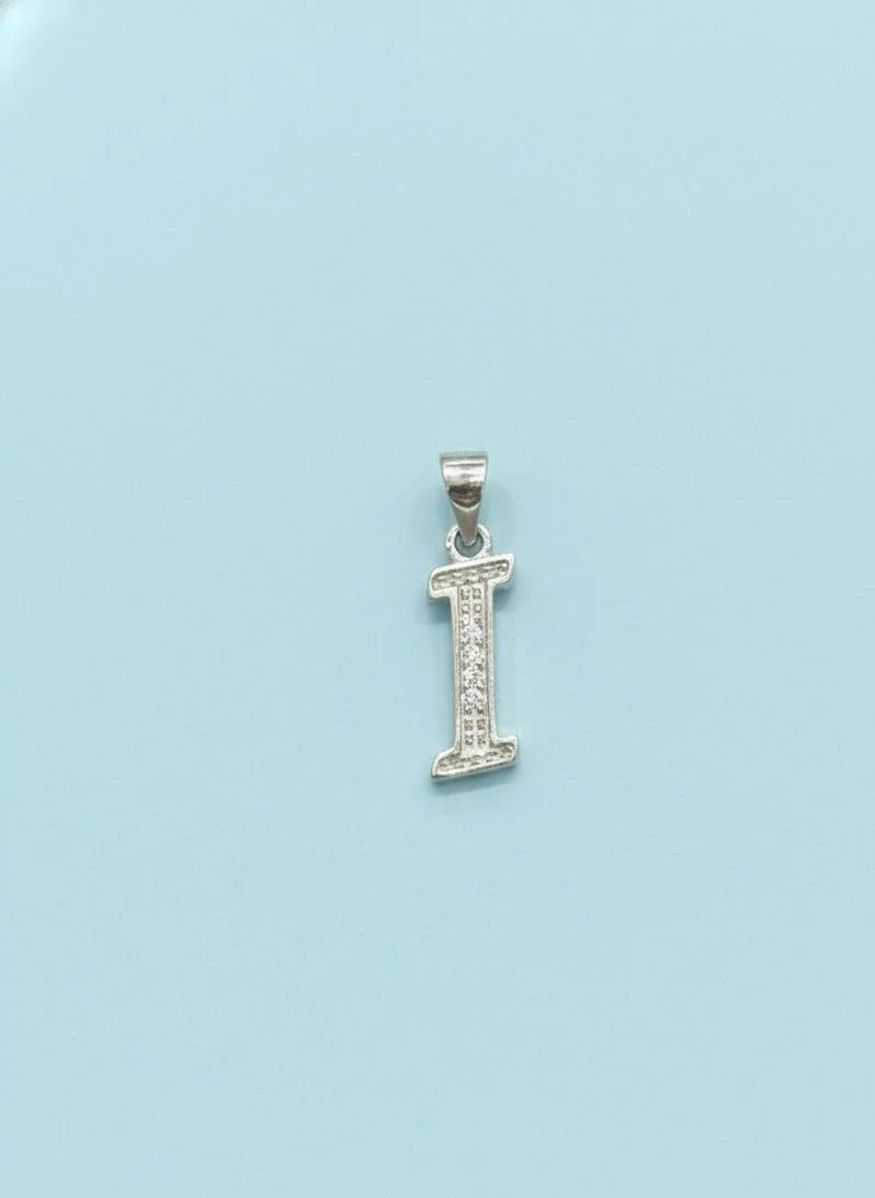 Silver letter 'I' pendant on a light blue background