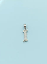 Silver letter 'I' pendant on a light blue background
