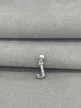Silver letter 'J' pendant on a gray fabric background