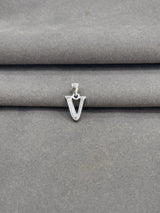 Silver 'V' shaped pendant on a gray fabric background