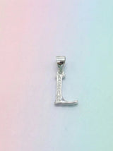 Silver 'L' pendant on a pastel gradient background
