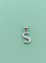 Silver 'S' pendant with clear stones on a light green background
