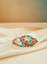 Decorative box with colorful design on a beige fabric background