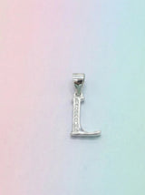 Silver 'L' pendant on a pastel gradient background