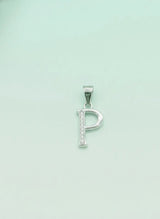 Silver 'P' pendant on a light green background