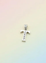Silver pendant with small stones on a gradient background