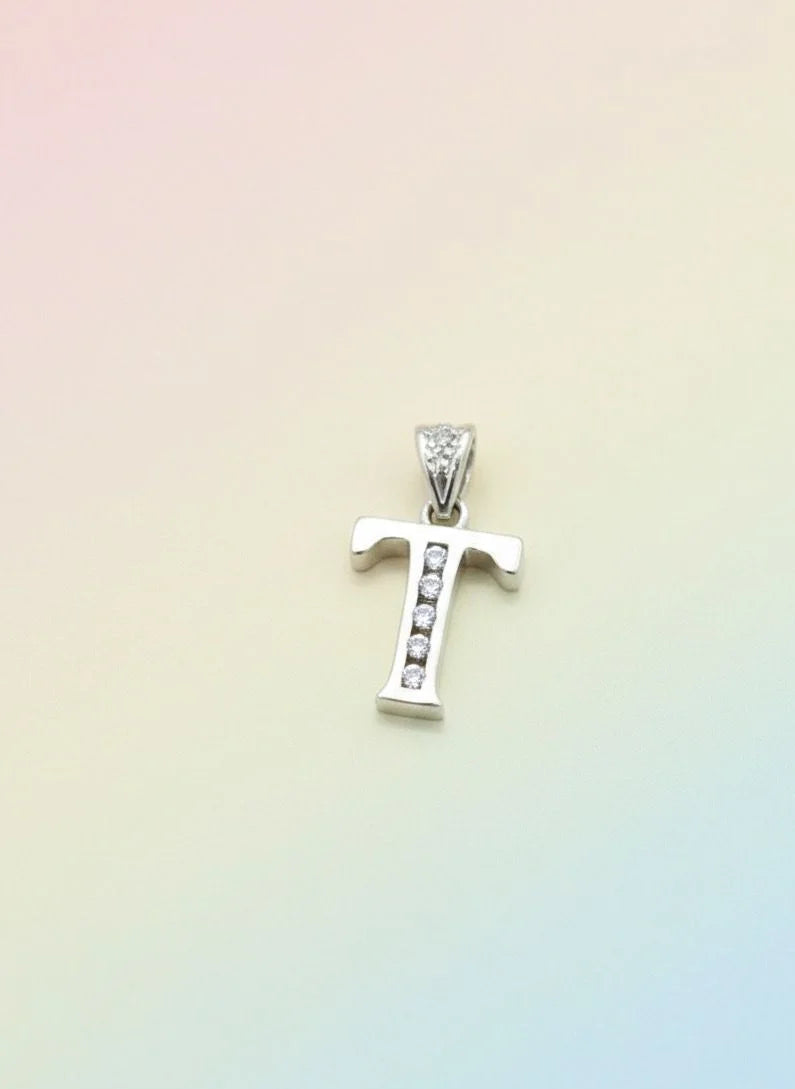 Silver pendant with small stones on a gradient background