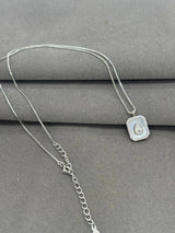 Pure 925 Silver necklace with a pendant on a gray fabric background