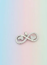 Silver infinity symbol pendant on a pastel gradient background