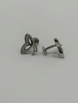 Pair of silver earrings on a light gray background