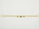 Gold chain with a decorative clasp on a white background