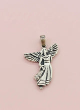 Silver angel pendant on a pink background