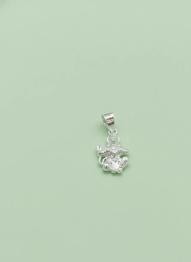 Silver pendant with a green background