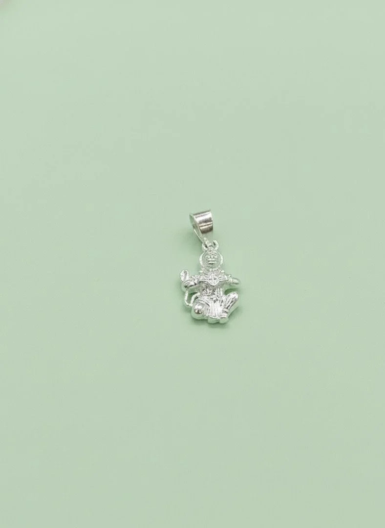 Silver pendant with a green background