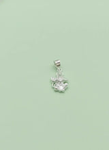 Silver pendant with a green background