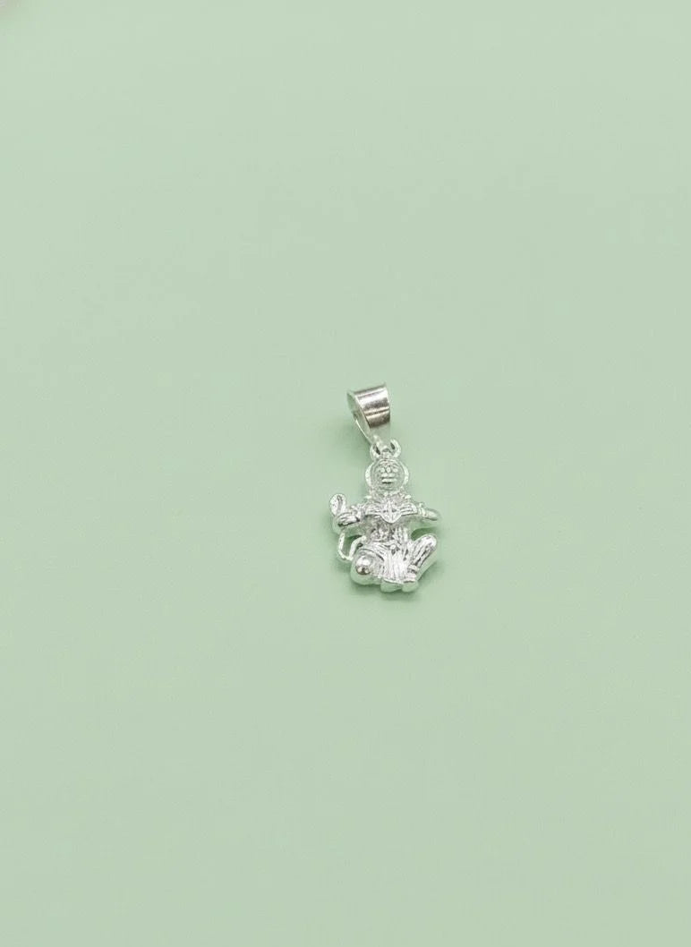 Silver pendant with a green background
