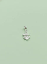 Silver pendant with a green background