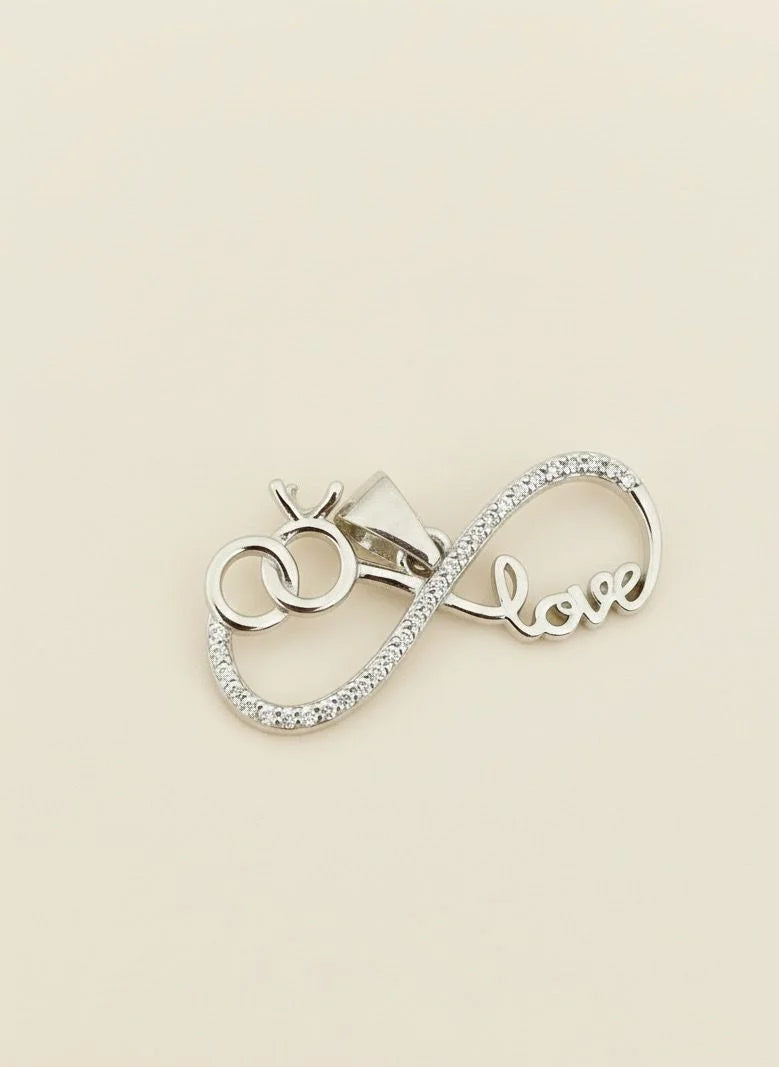 Silver Pendant with 'love' inscription on a beige background