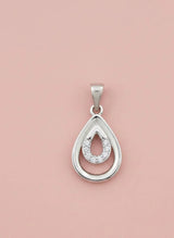 Silver teardrop pendant with embedded stones on a pink background