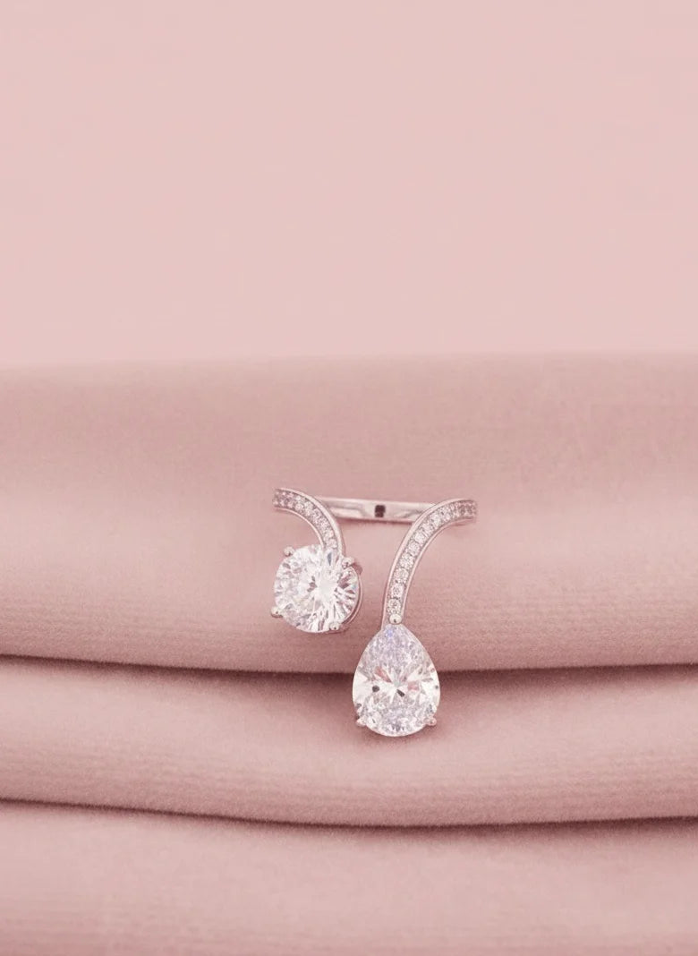 Diamond finish rings on a pink fabric background