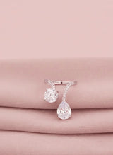 Diamond finish rings on a pink fabric background
