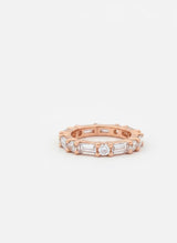Rose gold ring with diamonds on a white background