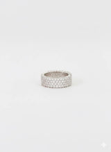 Silver ring with a textured band on a white background