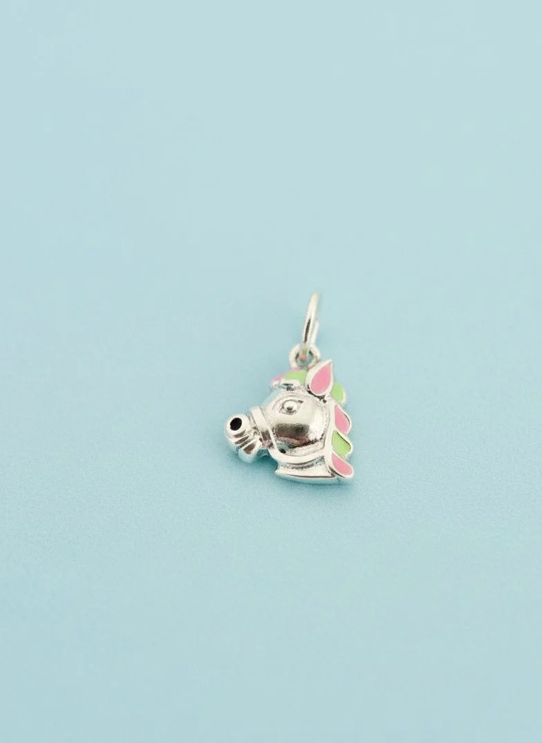 Unicorn-shaped charm on a light blue background