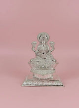 Silver statue on a pink background