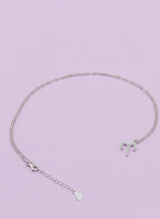 Pure 925 Silver necklace with a Aries pendant on a light purple background