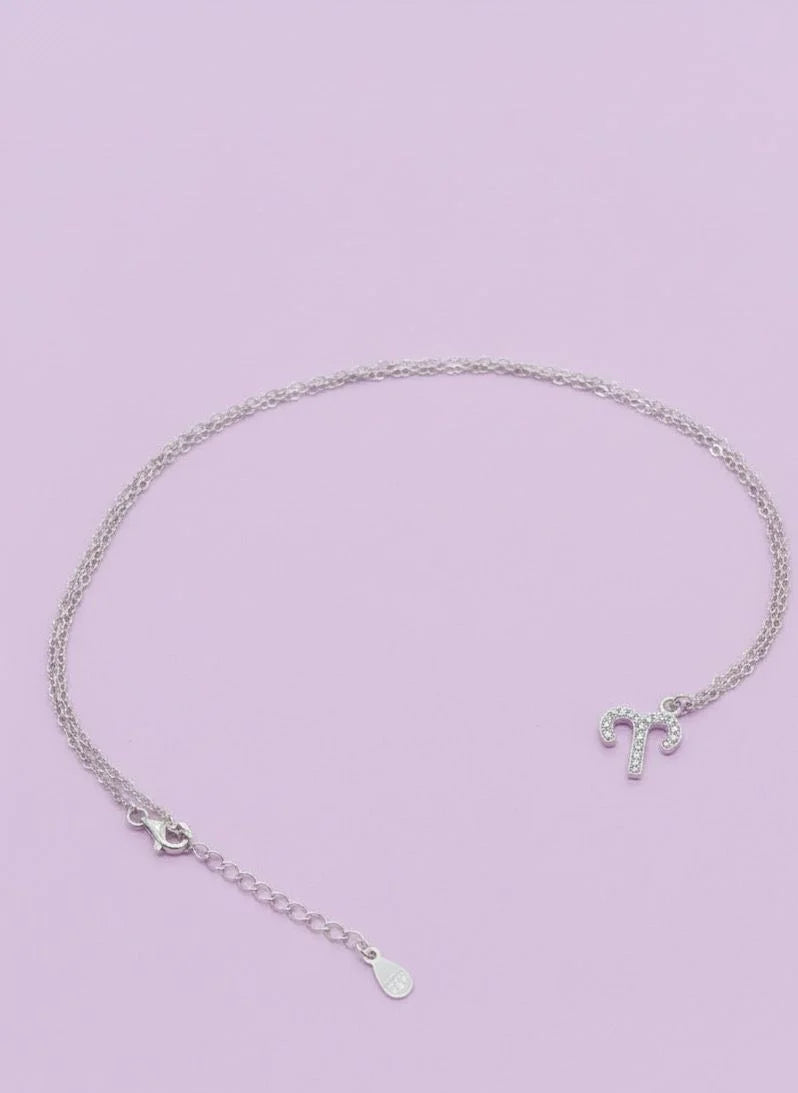 Pure 925 Silver necklace with a Aries pendant on a light purple background