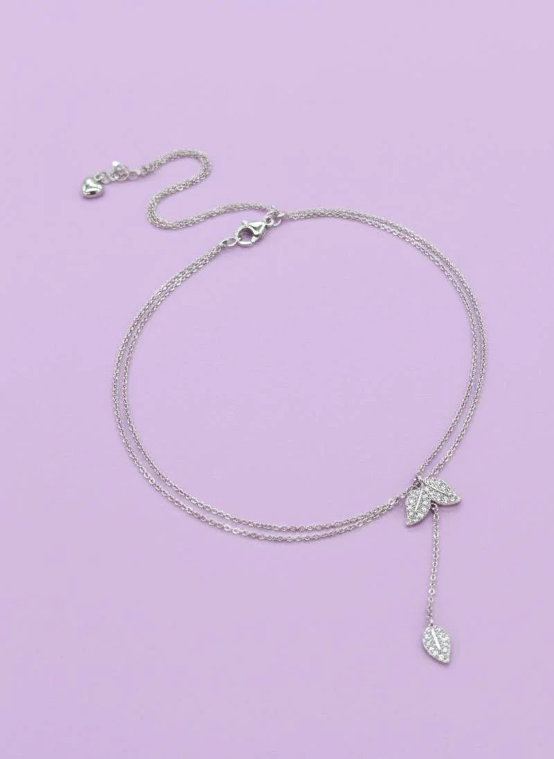 Pure 925 Silver necklace with leaf pendants on a light purple background