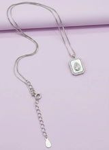 pure 925 Silver necklace with pendant on a light purple background