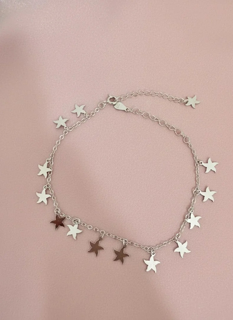 Star-shaped bracelet on a pink background