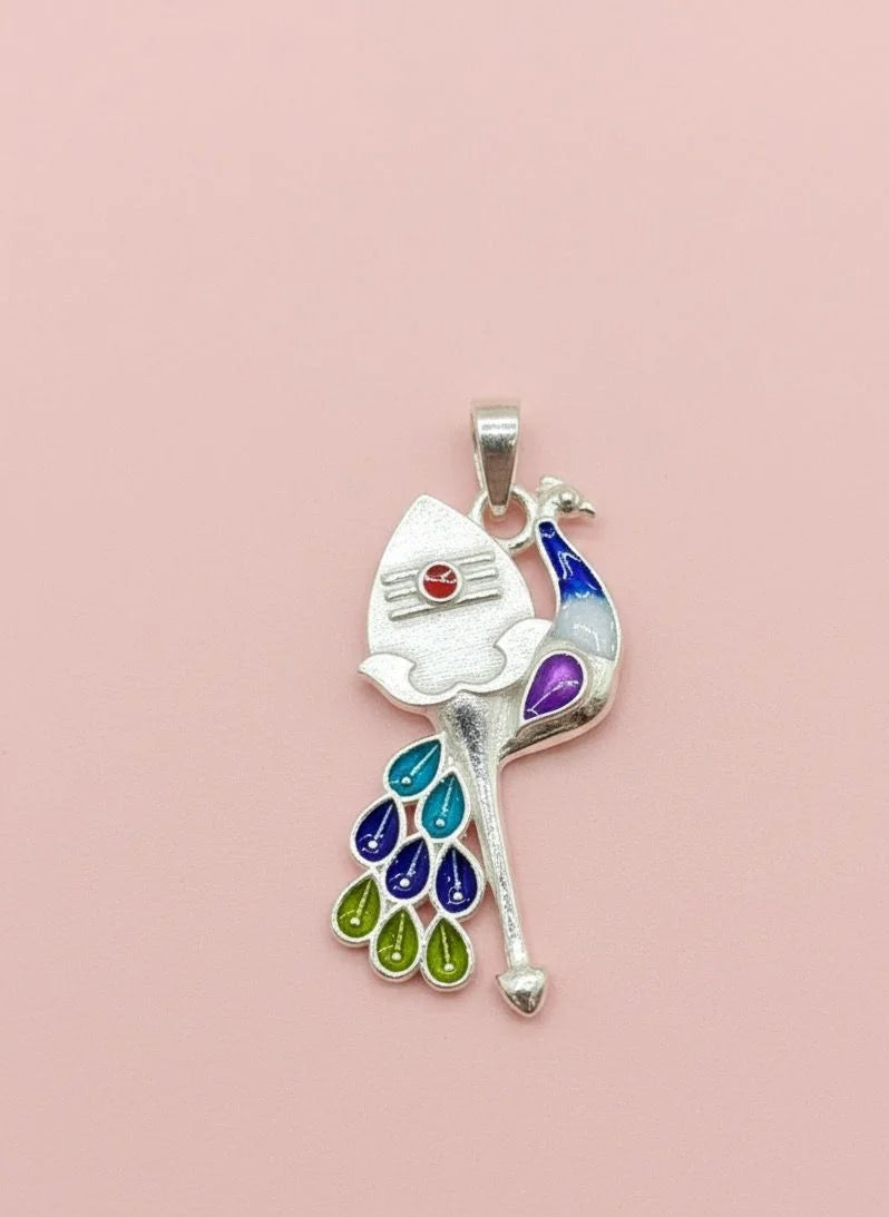 Colorful peacock-shaped pendant on a pink background