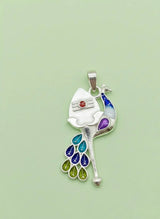 Colorful peacock feather pendant on a light green background