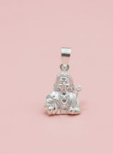 Silver pendant with a figure on a pink background
