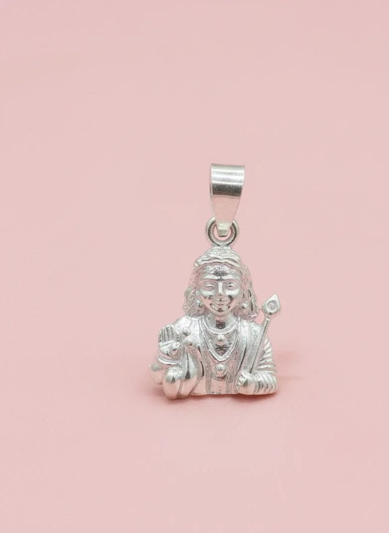 Silver pendant with a figure on a pink background
