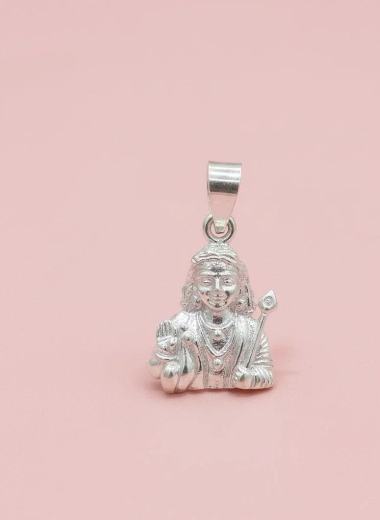 Silver pendant with a figure on a pink background
