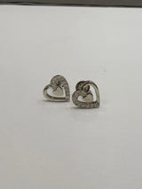 Heart-shaped earrings with clear stones on a white background